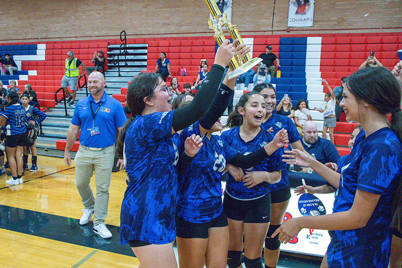 The Mansfeld girls volleyball team celebrates their win